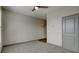 Bedroom featuring neutral carpet, a ceiling fan and an exterior door at 238 Walker Sw St # 32, Atlanta, GA 30313