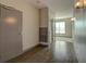 Hallway featuring wood flooring, doors, and natural light flowing in at 238 Walker Sw St # 32, Atlanta, GA 30313
