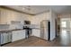 Well-lit kitchen features stainless steel appliances, white cabinets, granite countertops, and subway tile backsplash at 238 Walker Sw St # 32, Atlanta, GA 30313