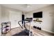 Bright home gym featuring a treadmill, mounted TV, and ceiling fan at 4371 Wigley Preserve Dr, Marietta, GA 30066