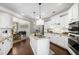 Bright kitchen with white cabinets, a center island, granite countertops and stainless appliances at 4371 Wigley Preserve Dr, Marietta, GA 30066