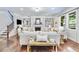 Spacious living room with a fireplace, custom built-ins, hardwood floors and comfortable seating at 4371 Wigley Preserve Dr, Marietta, GA 30066