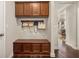A well-organized mudroom entry with bench, coat hooks, and storage at 4371 Wigley Preserve Dr, Marietta, GA 30066