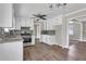 Bright kitchen features stainless steel appliances, granite countertops and white cabinets at 8989 Teal Ln, Jonesboro, GA 30236