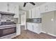 Kitchen features stainless steel appliances, stylish backsplash, and white cabinets at 8989 Teal Ln, Jonesboro, GA 30236