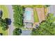 Bird's eye view of a neighborhood pool, clubhouse, and playground surrounded by lush greenery and manicured lawns at 3735 Turnbury Oaks Dr, Peachtree Corners, GA 30096