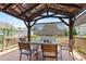 Covered back deck with seating and outdoor dining area, great for entertaining at 3735 Turnbury Oaks Dr, Peachtree Corners, GA 30096