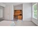 Bedroom with hardwood floors, window, and custom desk at 3735 Turnbury Oaks Dr, Peachtree Corners, GA 30096