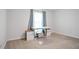 Neutral bedroom with carpet, window, and custom desk at 3735 Turnbury Oaks Dr, Peachtree Corners, GA 30096