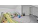 Well-lit bonus room with play gym, carpeted floors, and white walls at 3735 Turnbury Oaks Dr, Peachtree Corners, GA 30096