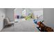 Large bonus room with carpet, toys, play gym, and seating at 3735 Turnbury Oaks Dr, Peachtree Corners, GA 30096