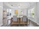 Dining room with tray ceilings and many windows at 3735 Turnbury Oaks Dr, Peachtree Corners, GA 30096