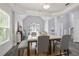 Spacious dining room with tray ceilings and many windows at 3735 Turnbury Oaks Dr, Peachtree Corners, GA 30096