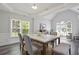 Bright dining room with marble-top table, trey ceiling, and large windows at 3735 Turnbury Oaks Dr, Peachtree Corners, GA 30096