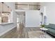 Open-concept space featuring modern fixtures, hardwood flooring and neutral paint at 3735 Turnbury Oaks Dr, Peachtree Corners, GA 30096