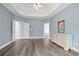 Spacious main bedroom features trey ceilings, wood floors, and ensuite bathroom at 3735 Turnbury Oaks Dr, Peachtree Corners, GA 30096