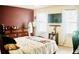 Bedroom with an accent wall, large bed, lots of sunlight and white curtains at 150 Ashley Dr, Fayetteville, GA 30214