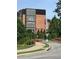 The Trilith Guesthouse exterior with beautifully landscaped grounds and flowers along the driveway at 150 Ashley Dr, Fayetteville, GA 30214