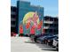 Exterior building with a large mural of a hummingbird, adjacent to a parking lot filled with cars at 150 Ashley Dr, Fayetteville, GA 30214
