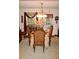 Traditional dining room featuring an elegant chandelier and seating for four at 150 Ashley Dr, Fayetteville, GA 30214