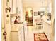 Bright kitchen featuring white cabinets, modern appliances, and an adjoining dining area at 150 Ashley Dr, Fayetteville, GA 30214