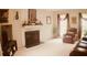 Living room with a fireplace, a neutral carpet, and comfortable seating at 150 Ashley Dr, Fayetteville, GA 30214
