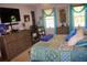 Bedroom featuring bright, natural light, colorful decor, and ample closet space at 150 Ashley Dr, Fayetteville, GA 30214