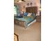 Spacious bedroom with a decorative headboard, soft lighting, and cozy bedding at 150 Ashley Dr, Fayetteville, GA 30214