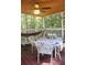 Cozy screened porch featuring comfortable seating, a hammock, and a ceiling fan for relaxation at 150 Ashley Dr, Fayetteville, GA 30214