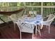 Charming screened porch with stylish outdoor seating, perfect for enjoying peaceful moments at 150 Ashley Dr, Fayetteville, GA 30214