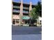 Exterior view of storefronts, including WoodStone and The Floral Stack, with patio furniture and landscaping at 150 Ashley Dr, Fayetteville, GA 30214