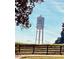 Trilith Studios water tower on a sunny day framed by trees against a blue sky backdrop at 150 Ashley Dr, Fayetteville, GA 30214