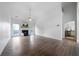 Bright, open living room with fireplace, ceiling fan, and access to kitchen at 3047 Standing Rock Ct, Lithia Springs, GA 30122