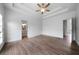 Bright, open main bedroom with wood-look floors and adjacent bathroom at 3047 Standing Rock Ct, Lithia Springs, GA 30122