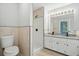 Bathroom features a shower, single vanity and neutral-toned tile at 4076 Whistler Dr, Douglasville, GA 30135