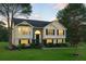 Inviting two-story home with well-manicured lawn and stylish exterior lighting at 4076 Whistler Dr, Douglasville, GA 30135