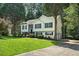 Traditional home featuring a well-kept lawn and a convenient driveway at 4076 Whistler Dr, Douglasville, GA 30135