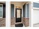 Inviting front door of a home with decorative brickwork and a well-lit entryway at 108 Berwick Crossing, Dallas, GA 30157