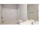 Cozy bathroom with a shower/tub combo, neutral walls, and a vanity with a mirror and updated lighting at 11768 Wellsley Way, Johns Creek, GA 30005