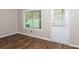 Bright room with door to outside and one window with blinds at 11768 Wellsley Way, Johns Creek, GA 30005