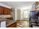 Well-lit kitchen with stainless steel appliances, granite countertops, and a breakfast nook at 11768 Wellsley Way, Johns Creek, GA 30005