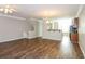 Cozy living room features wood flooring, bar-style seating, and a ceiling fan at 11768 Wellsley Way, Johns Creek, GA 30005