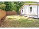 Fenced backyard featuring green space, flower beds, and the exterior of the home at 2294 Hill St, Atlanta, GA 30318