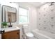 Bathroom showcasing a modern design with geometric tile, sleek fixtures, and natural light at 2294 Hill St, Atlanta, GA 30318