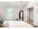 Comfortable bedroom with a window, a view to laundry room and stylish décor at 2294 Hill St, Atlanta, GA 30318