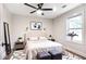 Bedroom features a ceiling fan, large window and modern decor at 2294 Hill St, Atlanta, GA 30318