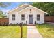 Charming home featuring a well-manicured lawn, mailbox, and a neatly numbered facade at 2294 Hill St, Atlanta, GA 30318