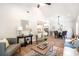 Spacious living room with modern furniture, wood floors, and an open layout to the kitchen at 2294 Hill St, Atlanta, GA 30318