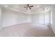Large bedroom with tray ceiling, carpet, recessed lighting, and multiple closets at 3961 S River Ln, Ellenwood, GA 30294
