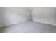 Spacious bedroom with neutral carpet and multiple closets for ample storage at 3961 S River Ln, Ellenwood, GA 30294